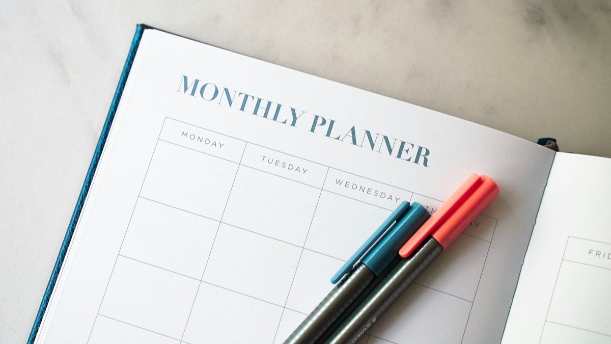 Monthly planner with two pens
