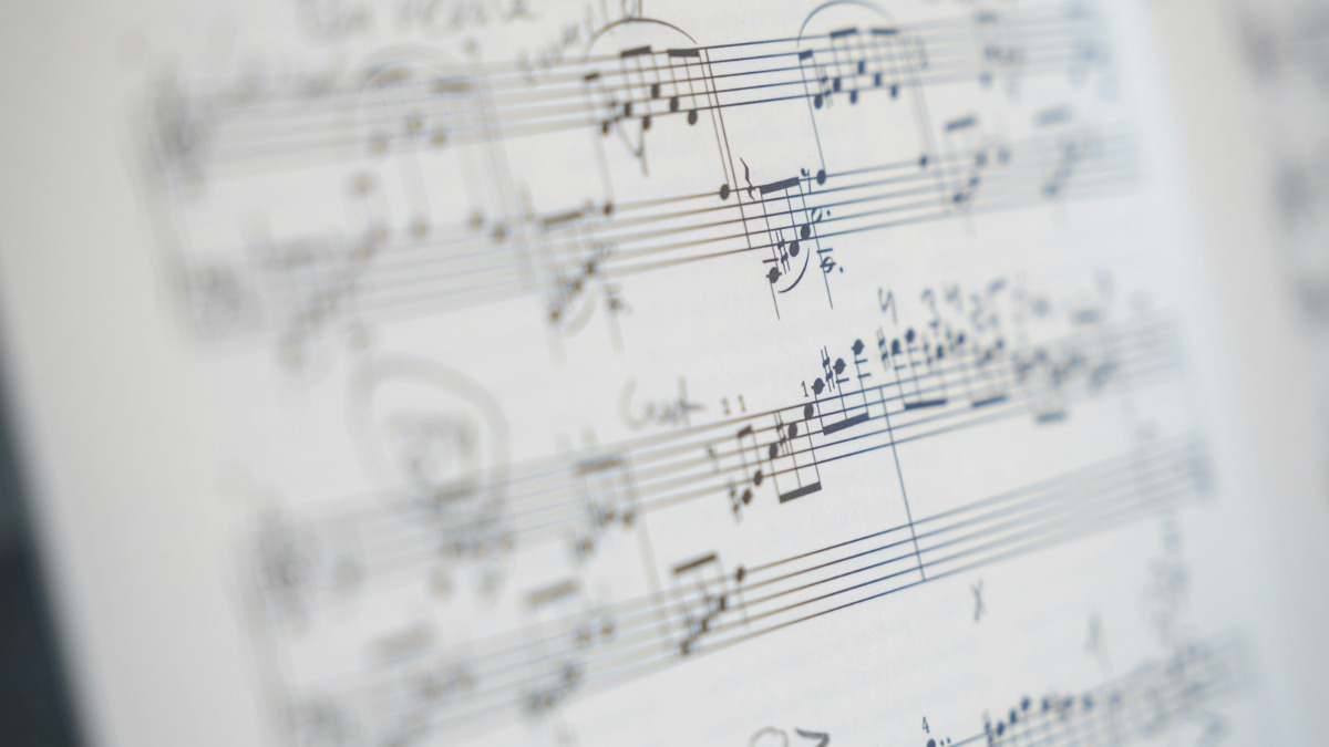 Close-up of printed sheet music with musical notes