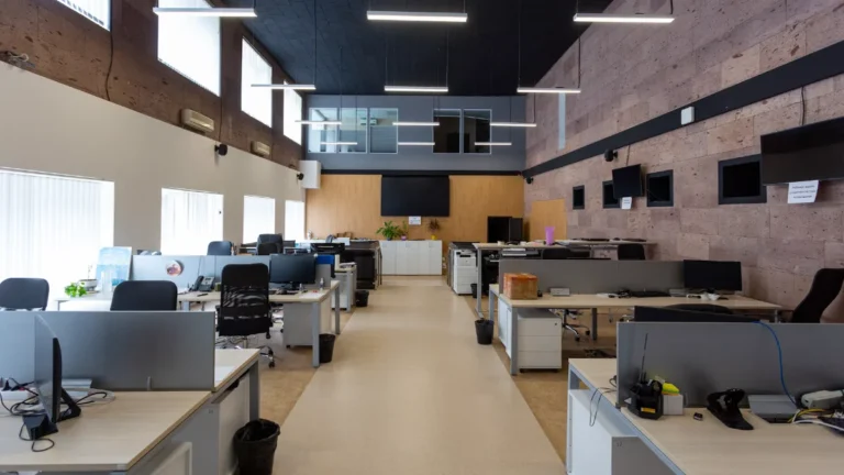 Rows of desks in a bright open-plan office